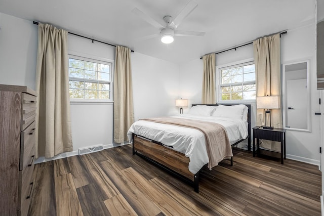 bedroom featuring dark wood-type flooring and ceiling fan