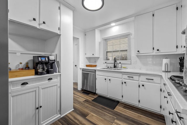 kitchen with appliances with stainless steel finishes, sink, and white cabinets