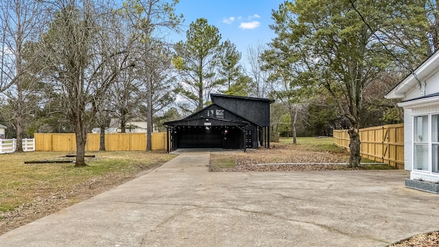 view of property exterior with a garage and a lawn