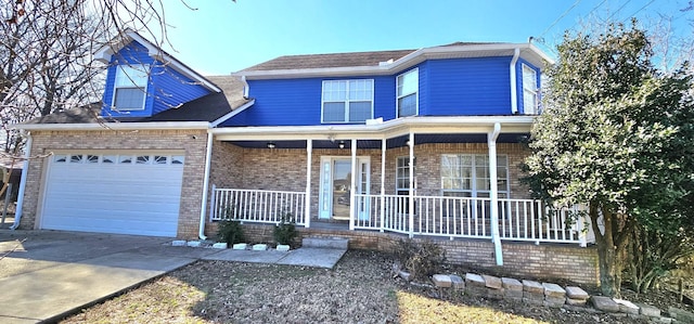 view of front of home with a garage, covered porch, concrete driveway, and brick siding