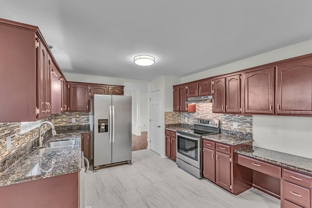 kitchen featuring decorative backsplash, marble finish floor, stainless steel appliances, under cabinet range hood, and a sink