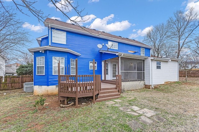 back of house with a yard, crawl space, fence, and a sunroom