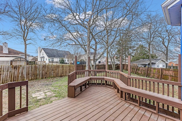 deck featuring a residential view and a fenced backyard