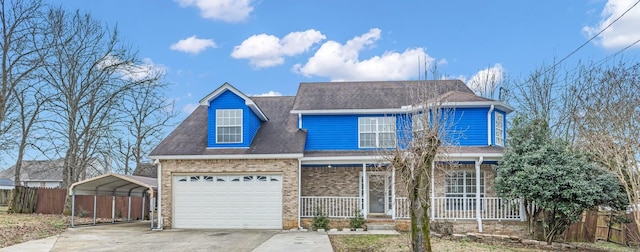 view of front of home featuring a porch, a garage, brick siding, concrete driveway, and a carport