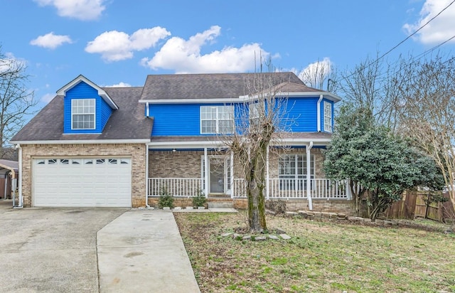 traditional-style house with an attached garage, covered porch, brick siding, fence, and driveway