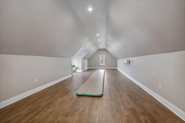 bonus room featuring lofted ceiling and wood-type flooring