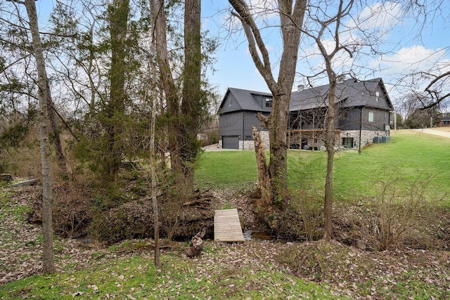 view of yard with a garage