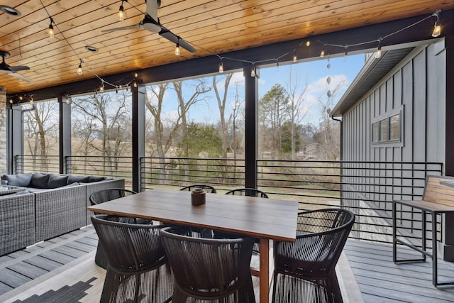 wooden deck with ceiling fan and an outdoor hangout area