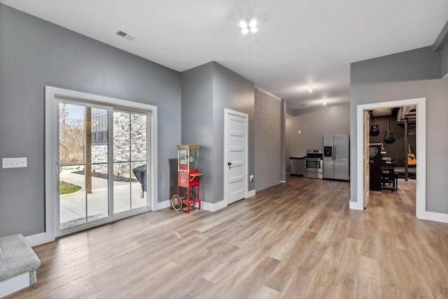 unfurnished living room featuring light hardwood / wood-style floors