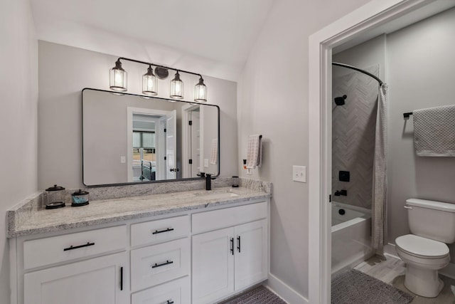 full bathroom with shower / tub combo with curtain, vanity, lofted ceiling, and toilet