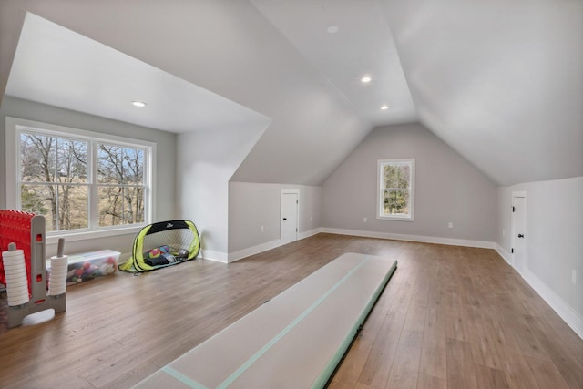 bonus room featuring lofted ceiling and light hardwood / wood-style flooring