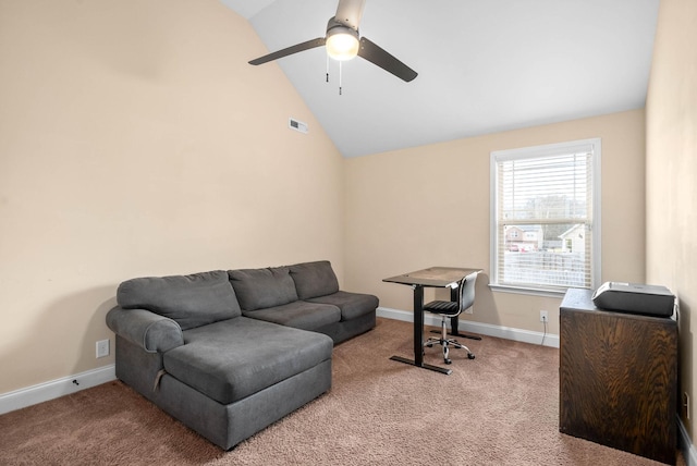 carpeted office space with vaulted ceiling and ceiling fan