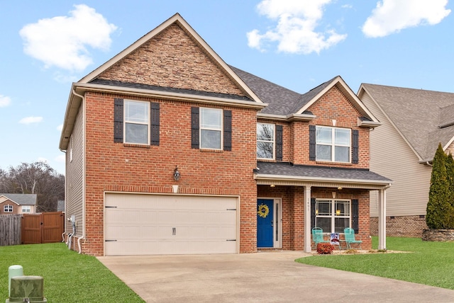 craftsman-style house with a garage, a porch, and a front yard