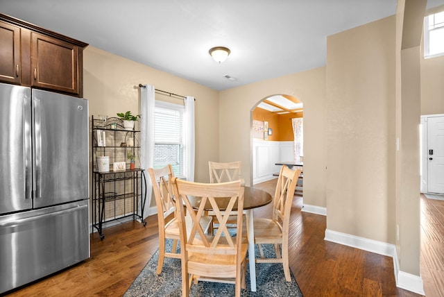 dining area with dark hardwood / wood-style floors