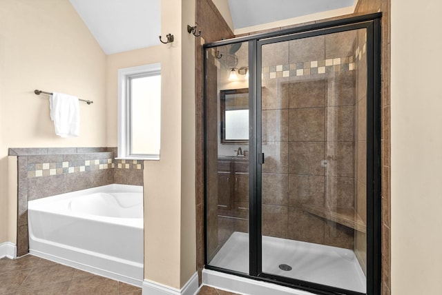 bathroom with lofted ceiling, tile patterned floors, and shower with separate bathtub