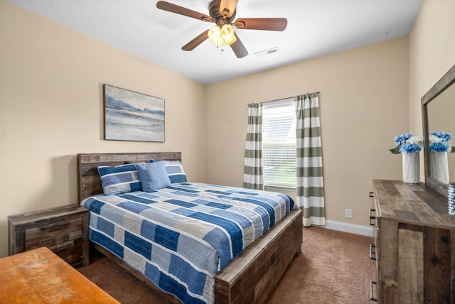 bedroom with dark colored carpet and ceiling fan