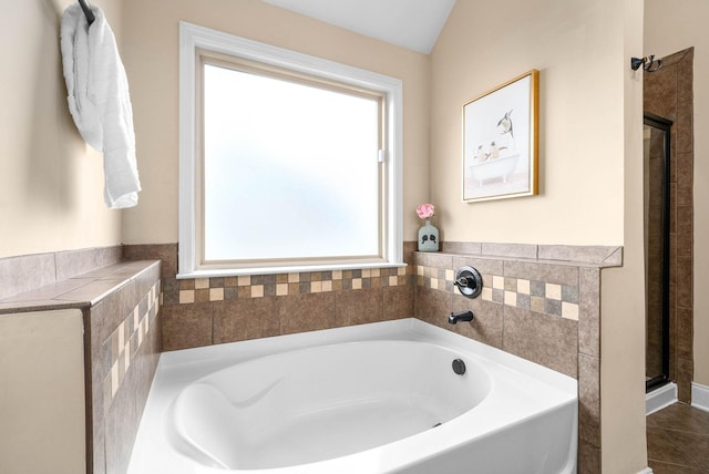 bathroom featuring tile patterned floors and a tub