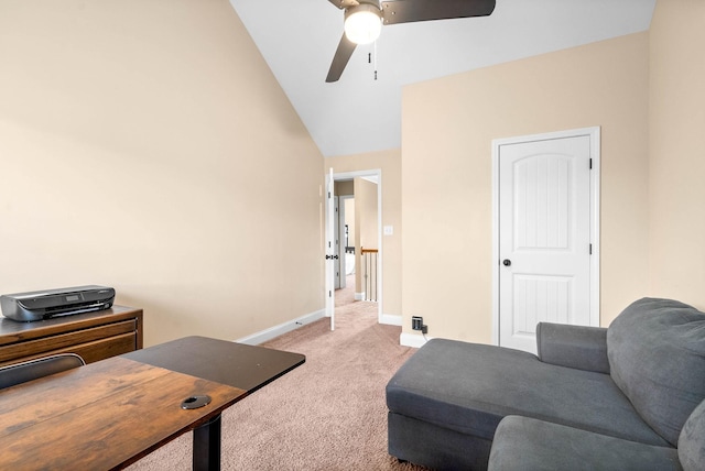 home office featuring vaulted ceiling, light colored carpet, and ceiling fan