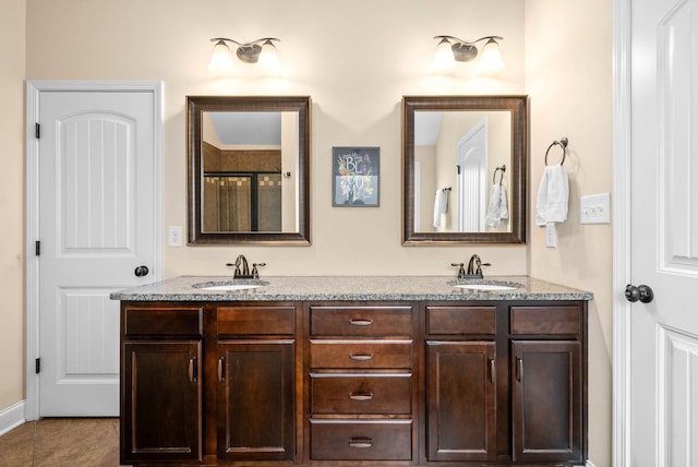 bathroom with vanity and tile patterned floors