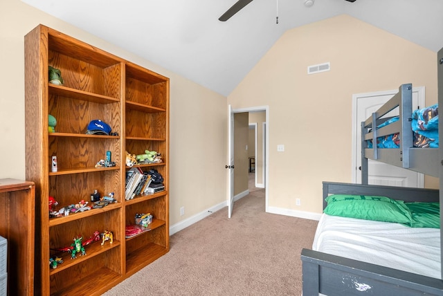 bedroom featuring ceiling fan, vaulted ceiling, and light carpet