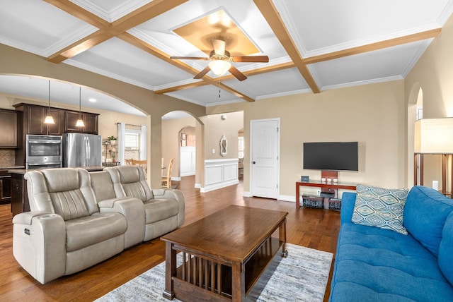 living room with wood-type flooring, coffered ceiling, ceiling fan, and beam ceiling