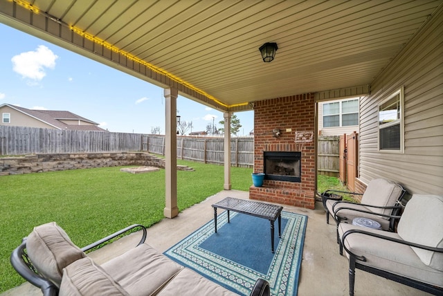 view of patio / terrace with an outdoor brick fireplace