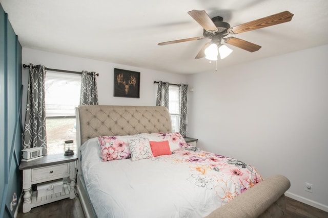 bedroom with ceiling fan and dark hardwood / wood-style flooring