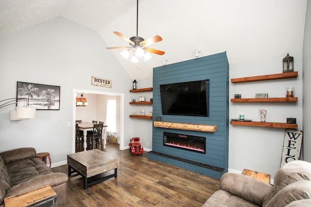 living room with ceiling fan, high vaulted ceiling, a large fireplace, and dark hardwood / wood-style flooring