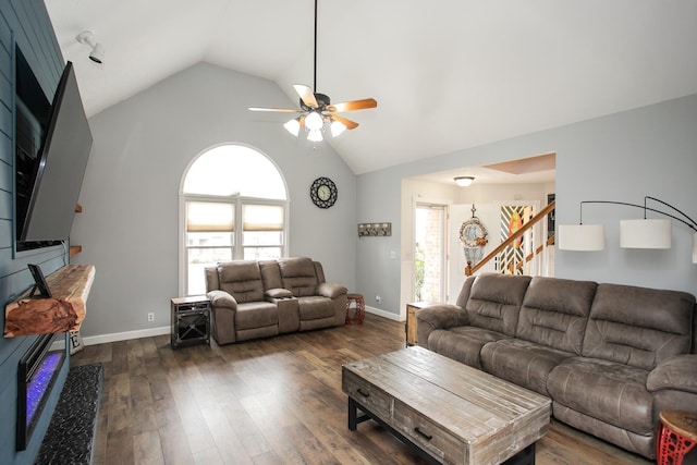 living room featuring ceiling fan, lofted ceiling, and dark hardwood / wood-style floors