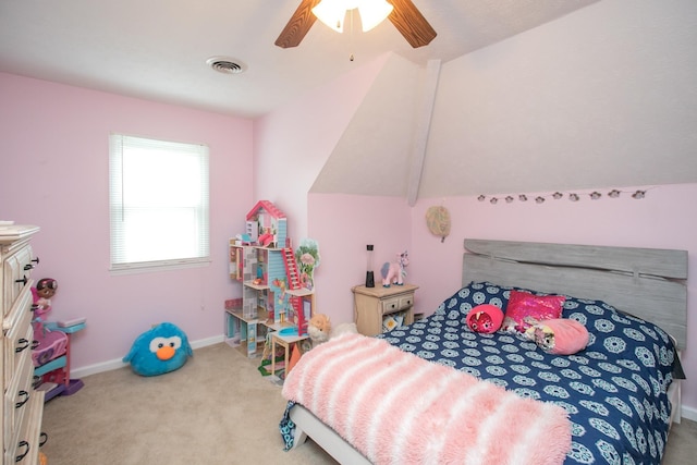 carpeted bedroom featuring vaulted ceiling and ceiling fan