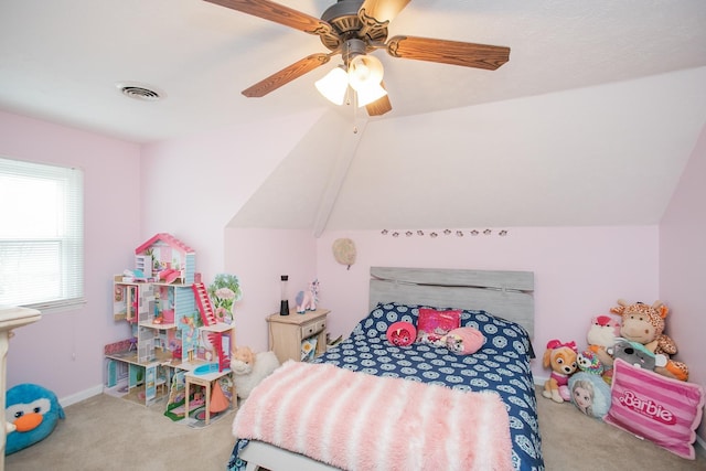 bedroom with vaulted ceiling, ceiling fan, and carpet flooring