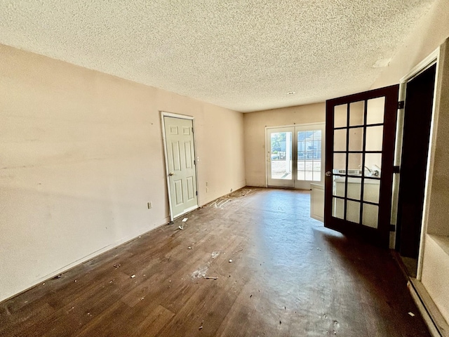 unfurnished room featuring a textured ceiling