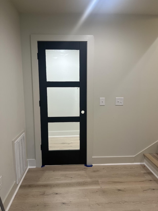 doorway to outside featuring light hardwood / wood-style flooring