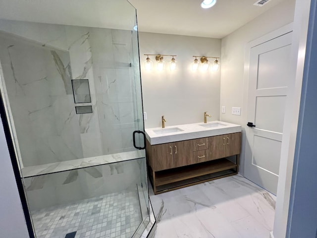 bathroom with vanity and a shower with shower door