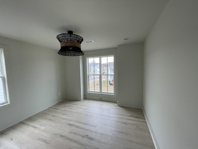 unfurnished room featuring light hardwood / wood-style flooring