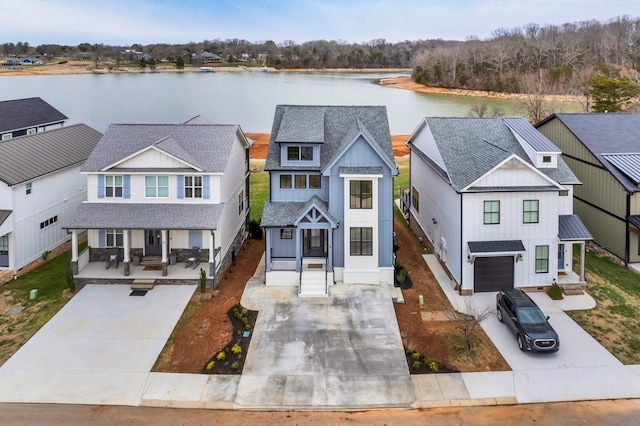 view of front of house featuring a porch, a water view, roof with shingles, a residential view, and board and batten siding