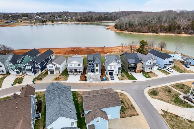 birds eye view of property featuring a residential view and a water view