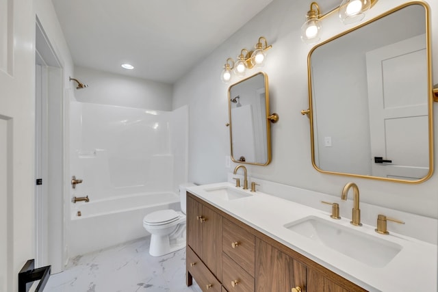 full bathroom with toilet, marble finish floor, bathtub / shower combination, and a sink