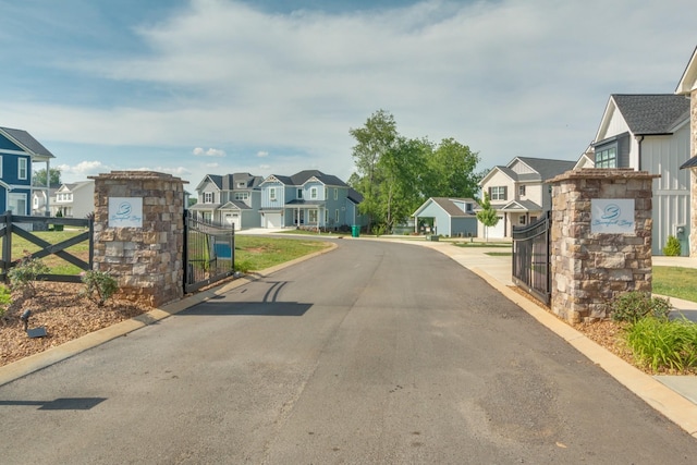 view of street featuring a gate and a residential view