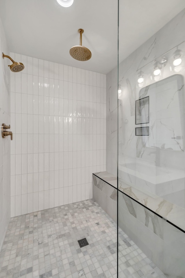 bathroom with a tile shower