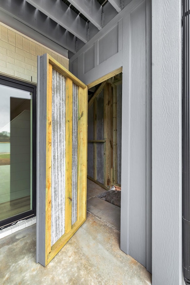 miscellaneous room featuring unfinished concrete floors