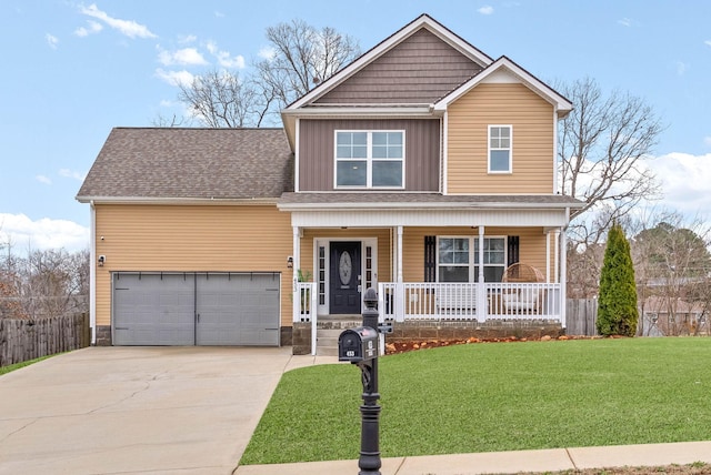 view of front of home featuring a garage, a front lawn, and a porch