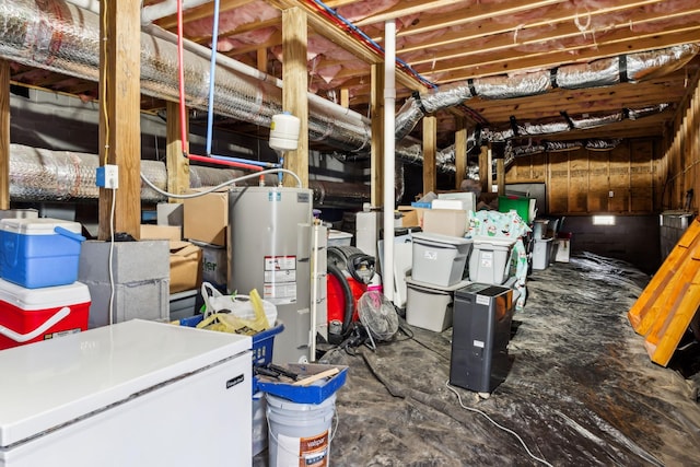 basement with refrigerator and water heater