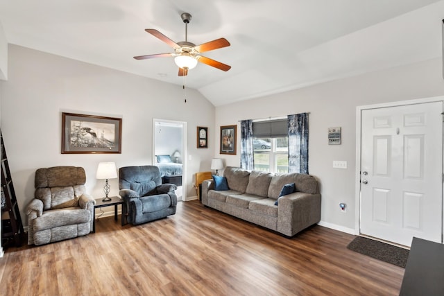 living room with lofted ceiling, wood-type flooring, and ceiling fan