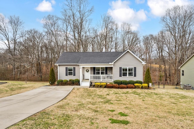 single story home with a porch and a front yard