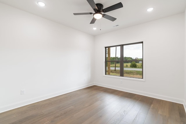 unfurnished room with wood-type flooring and ceiling fan