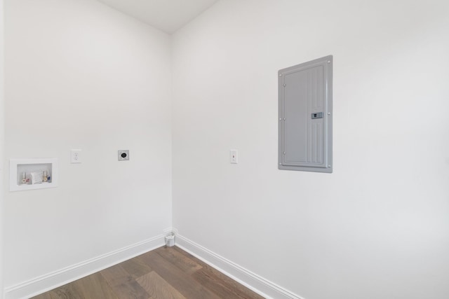 clothes washing area featuring dark hardwood / wood-style flooring, washer hookup, hookup for an electric dryer, and electric panel