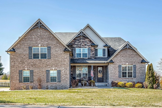 craftsman house with a front lawn