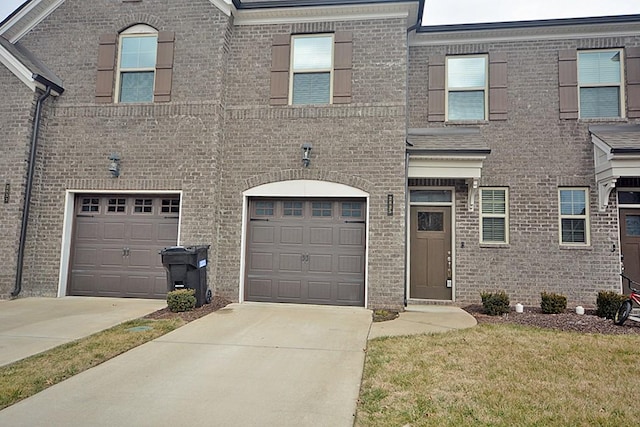 view of front of property with a garage and a front yard