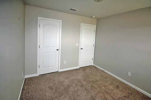 spare room featuring carpet flooring